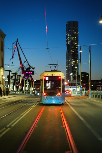 A tram at blue hour, a harbour crane behind it, rendered with OMR Color